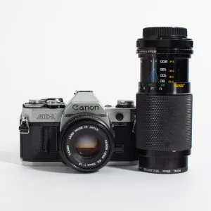 Canon AE-1 w/ 50mm FD f/1.8 and bonus telephoto zoom lens, body no. 1569485